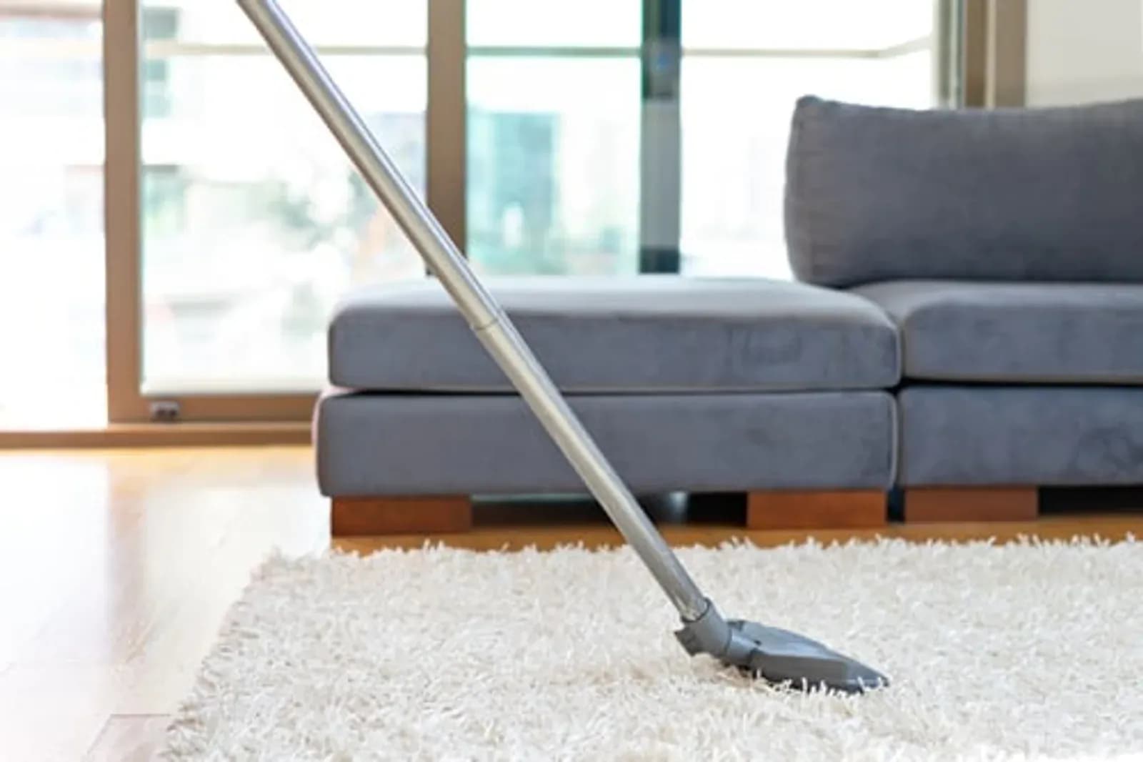 Bright, freshly cleaned living room being vacuumed by Enma Cleaning in Kenner, Louisiana